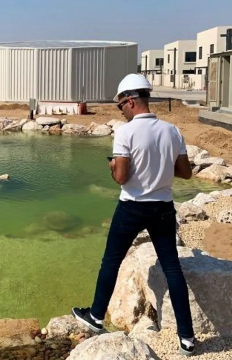 Omar Alhassan, founder of VORA, on a construction site